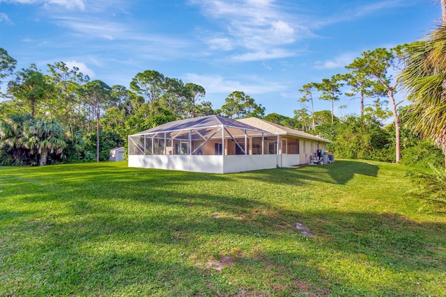 15550 73rd St N, The Acreage, FL 33470 - back of house featuring a lawn and a lanai