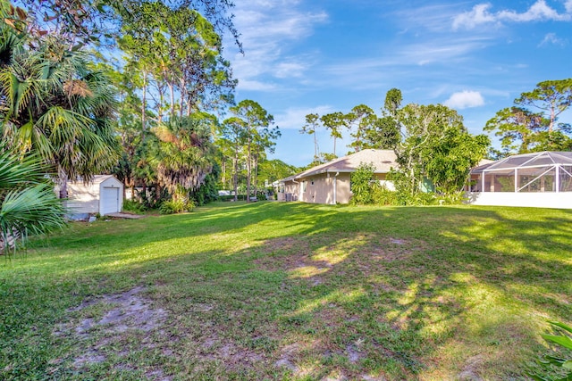 15550 73rd St N, The Acreage, FL 33470 - view of green lawn featuring a storage unit and an outbuilding