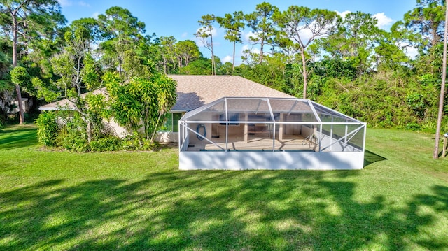 15550 73rd St N, The Acreage, FL 33470 - back of property with a lawn, a lanai, an outdoor pool, and a patio
