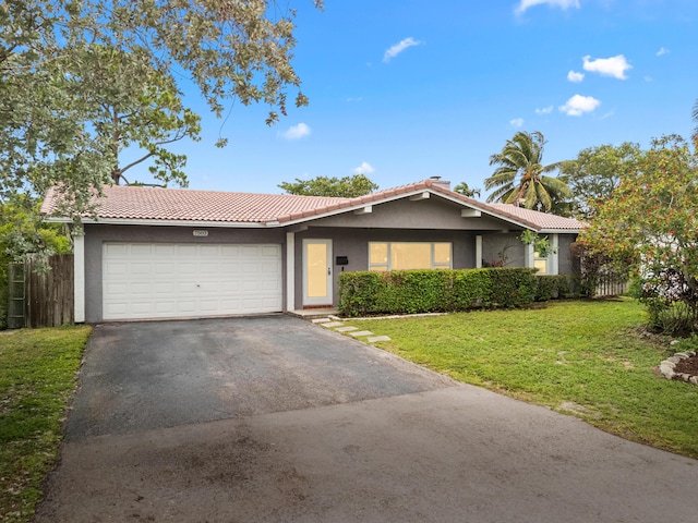 7503 NW 42nd St, Coral Springs, FL 33065 - ranch-style home featuring stucco siding, asphalt driveway, a garage, and a tiled roof