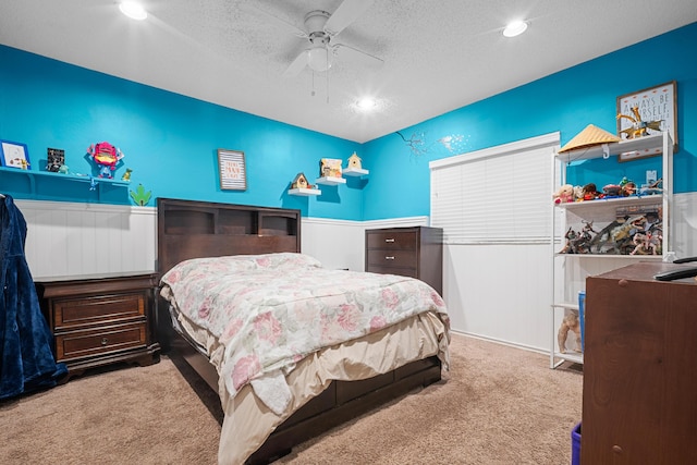 7503 NW 42nd St, Coral Springs, FL 33065 - bedroom featuring carpet flooring, wainscoting, a textured ceiling, and a ceiling fan