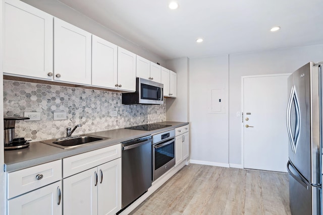 44 Cocoanut Row Unit 626B, Palm Beach, FL 33480 - kitchen featuring stainless steel appliances, a sink, decorative backsplash, white cabinetry, and recessed lighting