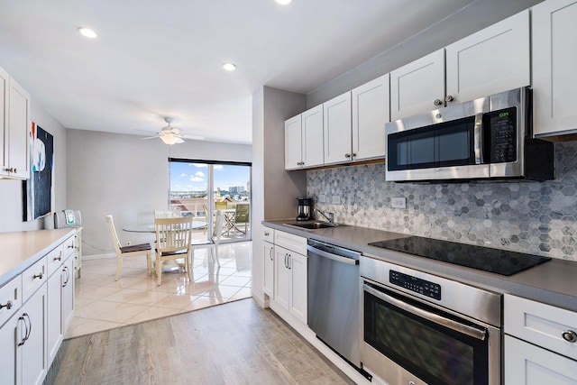 44 Cocoanut Row Unit 626B, Palm Beach, FL 33480 - kitchen featuring stainless steel appliances, ceiling fan, a sink, backsplash, and recessed lighting