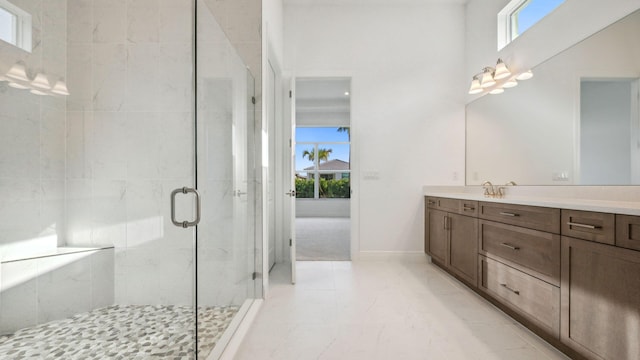 9143 SW Esule Way, Port Saint Lucie, FL 34987 - bathroom with healthy amount of natural light, a stall shower, vanity, and marble finish floors