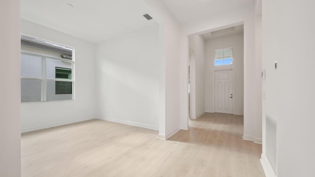 9143 SW Esule Way, Port Saint Lucie, FL 34987 - empty room with light wood-style floors and baseboards