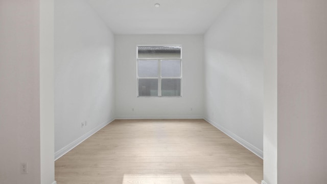 9143 SW Esule Way, Port Saint Lucie, FL 34987 - spare room featuring light wood-type flooring and baseboards