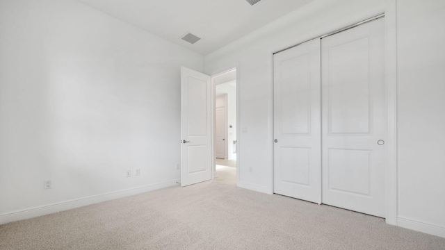 9143 SW Esule Way, Port Saint Lucie, FL 34987 - unfurnished bedroom with light colored carpet, a closet, and baseboards