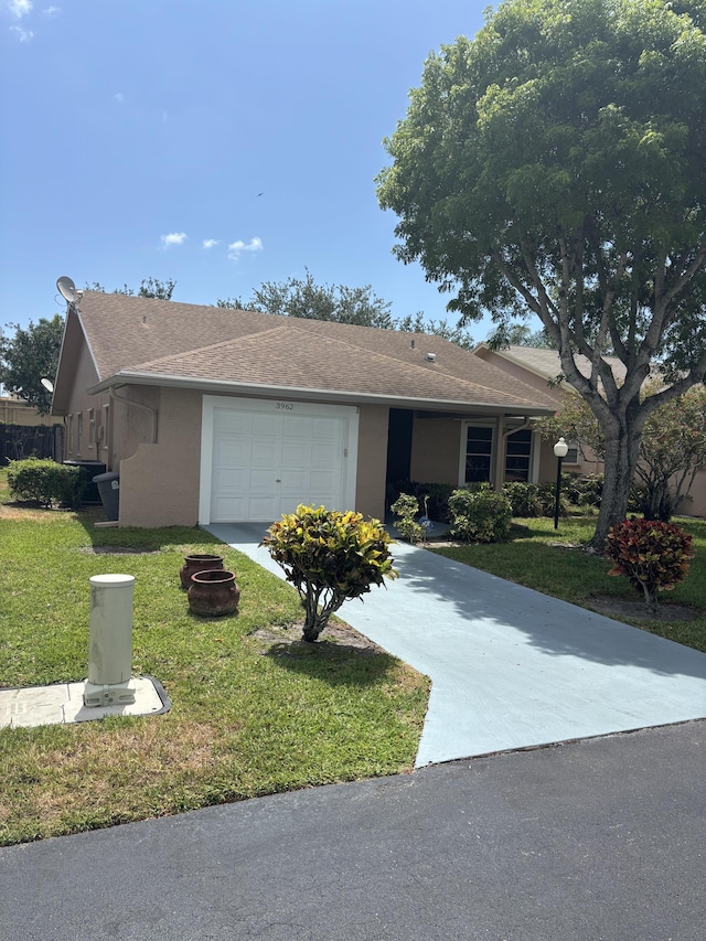 3962 Dafilee Cir, West Palm Beach, FL 33417 - single story home featuring a garage, concrete driveway, a front lawn, stucco siding, and roof with shingles