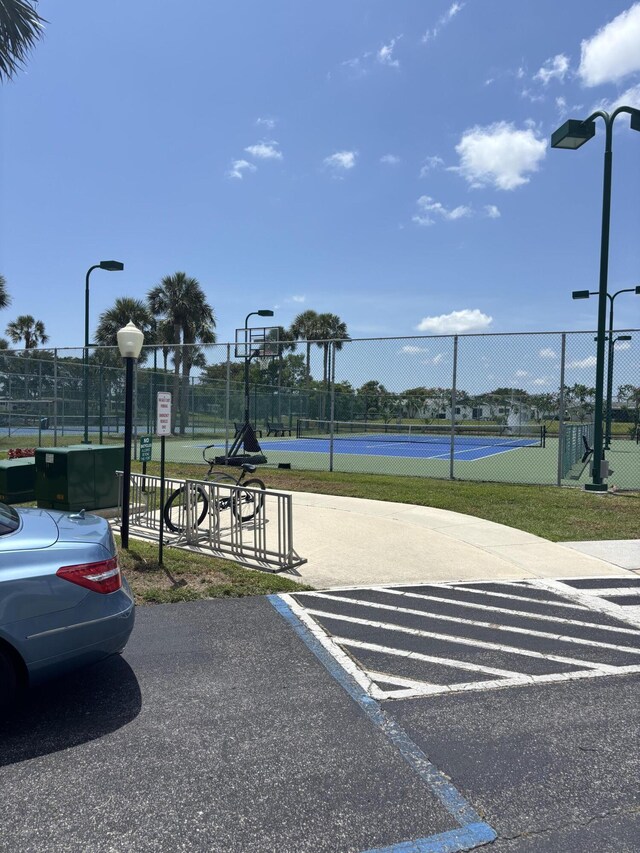3962 Dafilee Cir, West Palm Beach, FL 33417 - uncovered parking lot featuring a tennis court