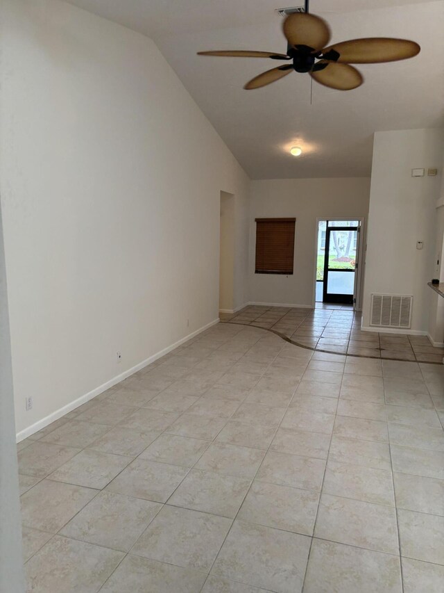 3962 Dafilee Cir, West Palm Beach, FL 33417 - unfurnished room featuring a ceiling fan, vaulted ceiling, light tile patterned floors, and baseboards