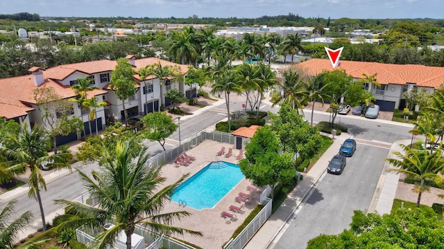 aerial view of residential area with a pool area