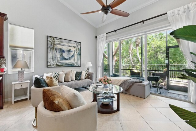 4635 Mediterranean Cir, Palm Beach Gardens, FL 33418 - living area featuring vaulted ceiling, light tile patterned floors, crown molding, and a ceiling fan