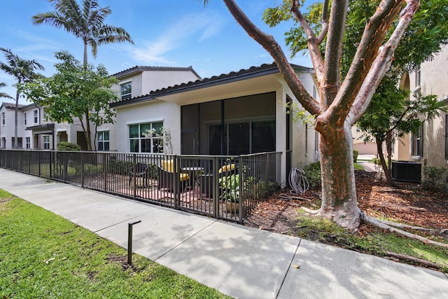 4635 Mediterranean Cir, Palm Beach Gardens, FL 33418 - view of property exterior with stucco siding, central air condition unit, fence, and a tile roof