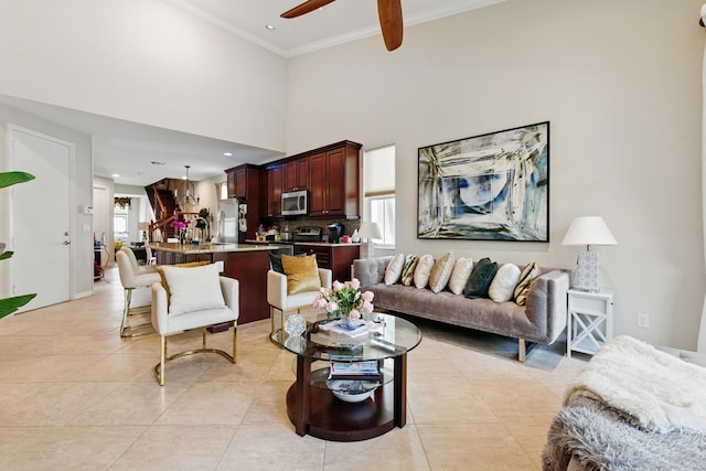 4635 Mediterranean Cir, Palm Beach Gardens, FL 33418 - living area featuring ornamental molding, ceiling fan, light tile patterned flooring, a high ceiling, and recessed lighting