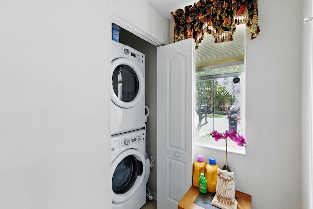 4635 Mediterranean Cir, Palm Beach Gardens, FL 33418 - washroom with stacked washing machine and dryer