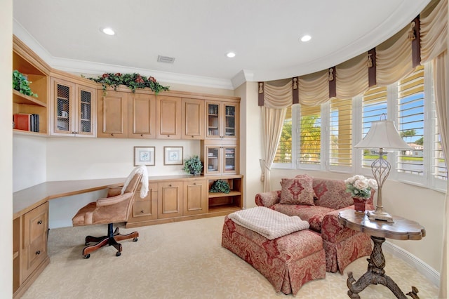 office space featuring built in desk, crown molding, recessed lighting, and carpet