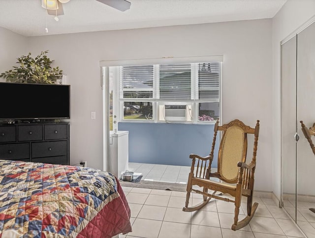 226 Northampton L Unit 226, West Palm Beach, FL 33417 - bedroom featuring light tile patterned floors, cooling unit, and a ceiling fan