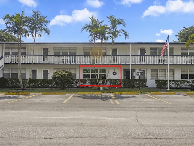 226 Northampton L Unit 226, West Palm Beach, FL 33417 - view of building exterior featuring uncovered parking