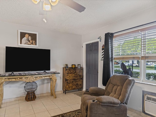 226 Northampton L Unit 226, West Palm Beach, FL 33417 - sitting room featuring a textured ceiling, ceiling fan, and tile patterned flooring