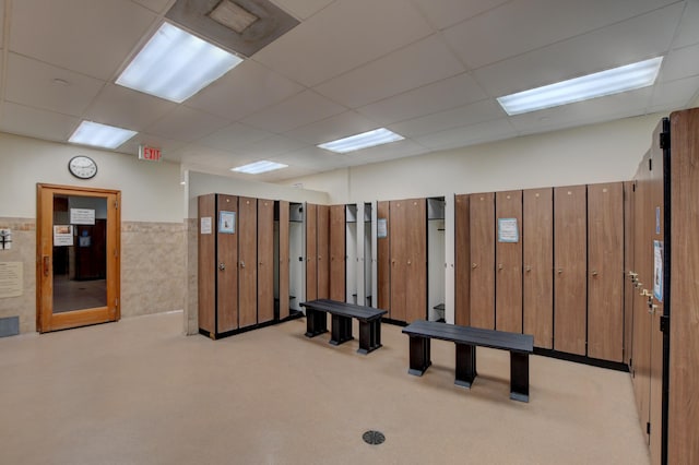 196 Upminster L Unit 196, Deerfield Beach, FL 33442 - misc room with a paneled ceiling, tile walls, light colored carpet, and a wainscoted wall