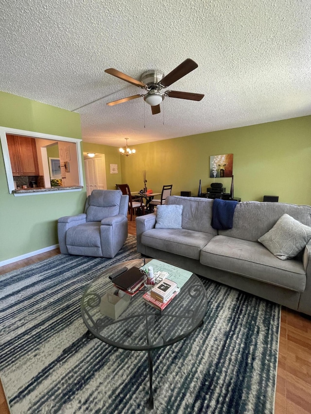 196 Upminster L Unit 196, Deerfield Beach, FL 33442 - living room featuring a chandelier, a ceiling fan, and a textured ceiling
