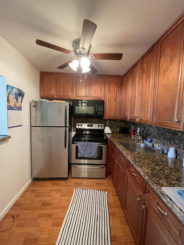 196 Upminster L Unit 196, Deerfield Beach, FL 33442 - kitchen featuring stainless steel appliances, brown cabinets, a sink, and a ceiling fan