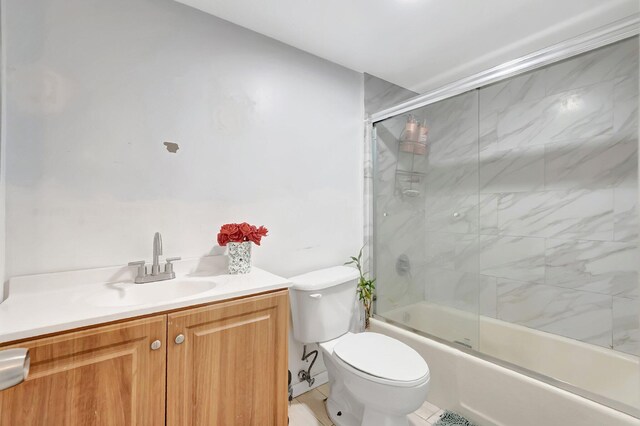 1124 NW 13th St Unit 208, Boca Raton, FL 33486 - bathroom with toilet, shower / bath combination with glass door, and vanity