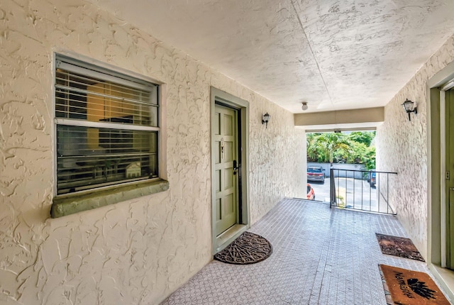 1124 NW 13th St Unit 208, Boca Raton, FL 33486 - view of exterior entry with covered porch and stucco siding