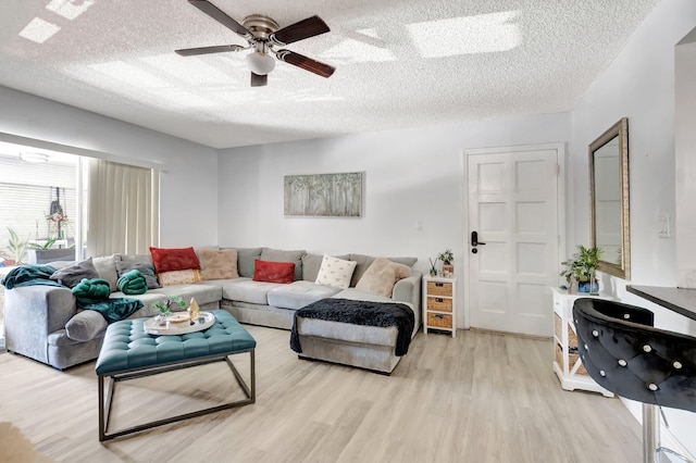 1124 NW 13th St Unit 208, Boca Raton, FL 33486 - living room with wood finished floors, ceiling fan, and a textured ceiling