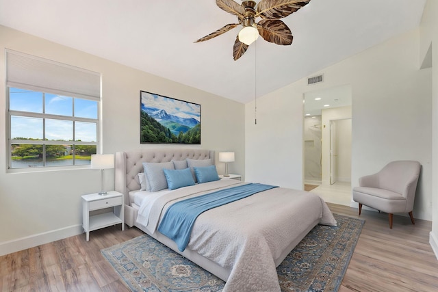 1388 Garden Rd, Weston, FL 33326 - bedroom featuring vaulted ceiling, light wood finished floors, a ceiling fan, and ensuite bathroom