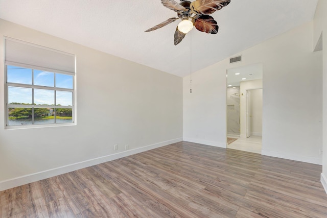 1388 Garden Rd, Weston, FL 33326 - empty room with vaulted ceiling, a ceiling fan, and light wood finished floors