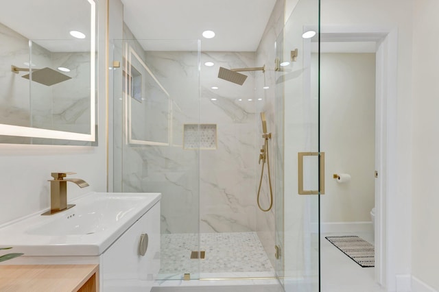1388 Garden Rd, Weston, FL 33326 - bathroom featuring a marble finish shower, vanity, and recessed lighting
