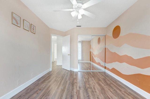 1388 Garden Rd, Weston, FL 33326 - unfurnished bedroom featuring wood finished floors, a closet, and ceiling fan