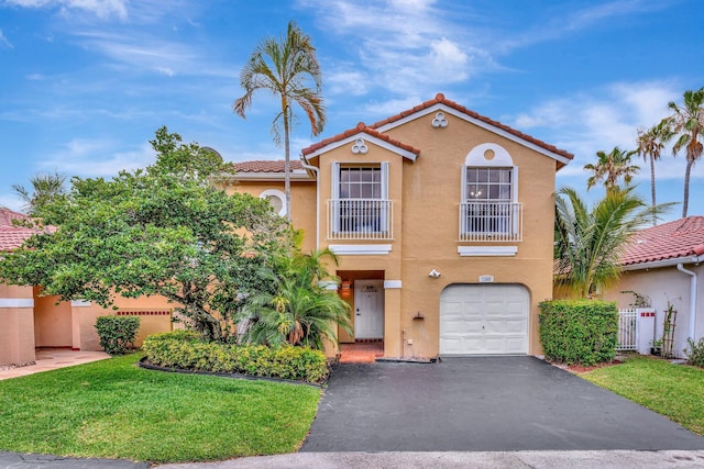 1388 Garden Rd, Weston, FL 33326 - mediterranean / spanish-style home with stucco siding, a tiled roof, a garage, driveway, and a balcony