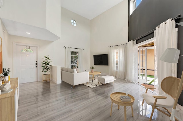 1388 Garden Rd, Weston, FL 33326 - living area featuring a towering ceiling and wood finished floors