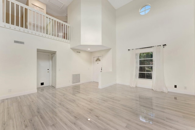 1388 Garden Rd, Weston, FL 33326 - unfurnished living room featuring wood finished floors and a high ceiling