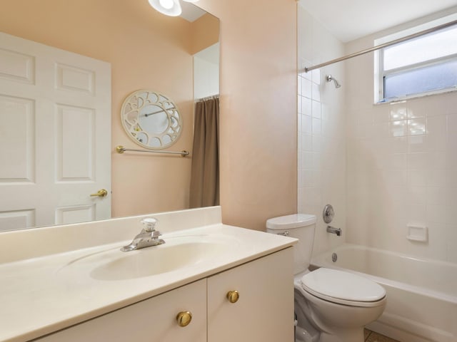 full bath featuring vanity, toilet, and shower / washtub combination