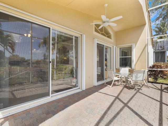 view of patio with ceiling fan and outdoor dining space