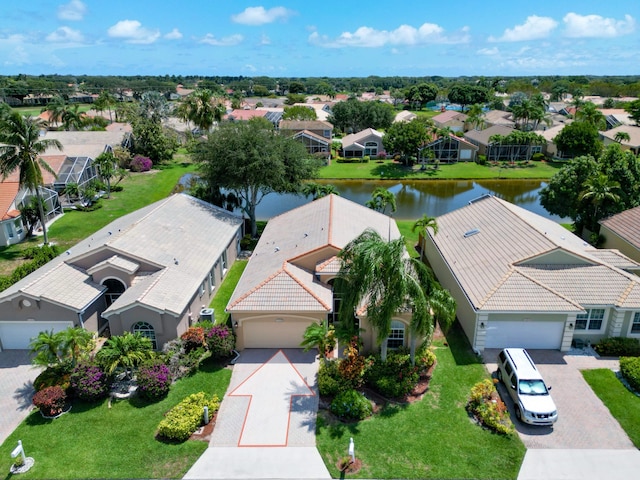 aerial perspective of suburban area featuring a nearby body of water