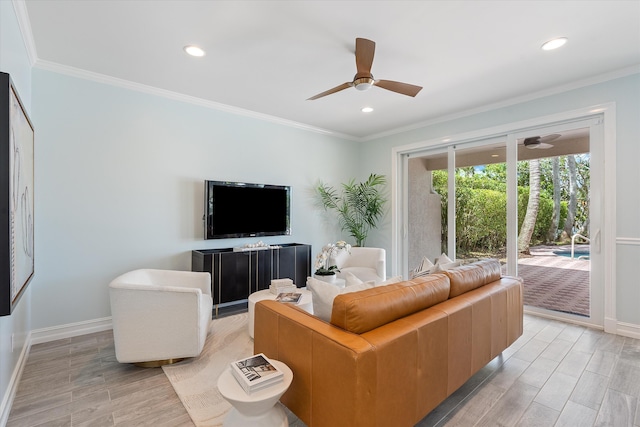 living area with a ceiling fan, baseboards, light wood-style floors, recessed lighting, and crown molding