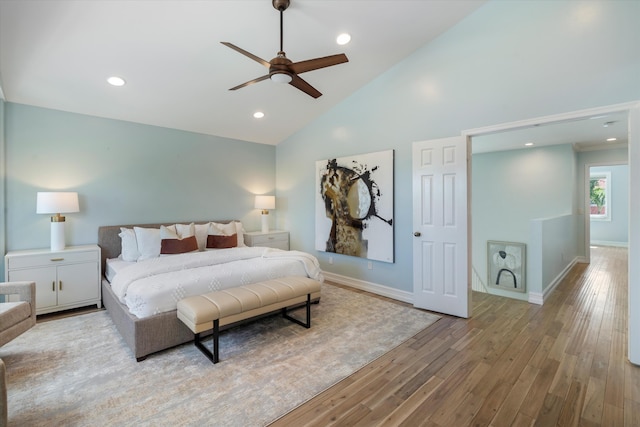 bedroom featuring wood finished floors, baseboards, high vaulted ceiling, recessed lighting, and ceiling fan