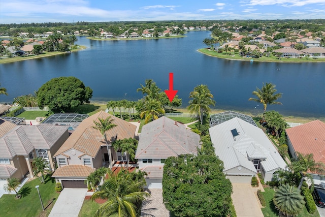 aerial view of residential area with a large body of water