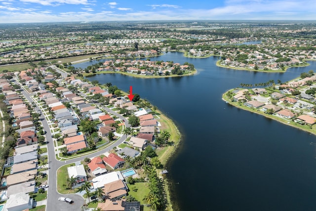 aerial overview of property's location with nearby suburban area and a nearby body of water