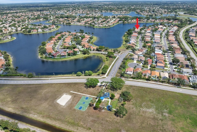 aerial overview of property's location featuring a nearby body of water and nearby suburban area
