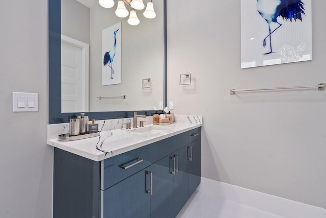 bathroom featuring vanity and a chandelier