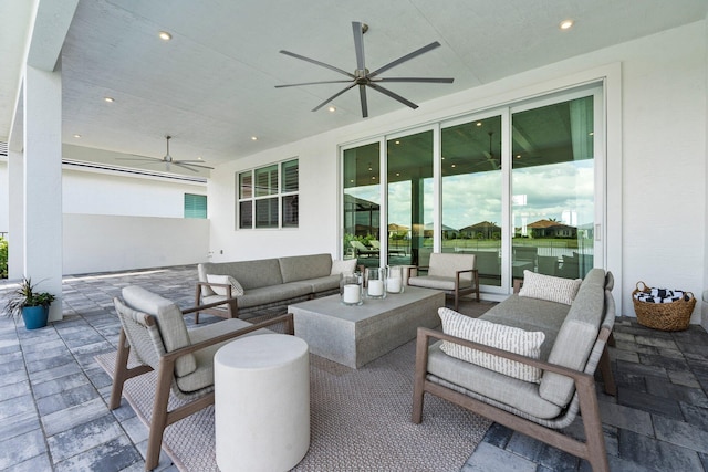 view of patio with a ceiling fan and an outdoor living space