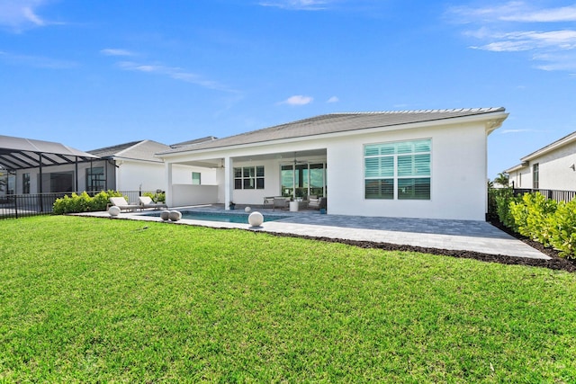 back of property with a patio area and stucco siding