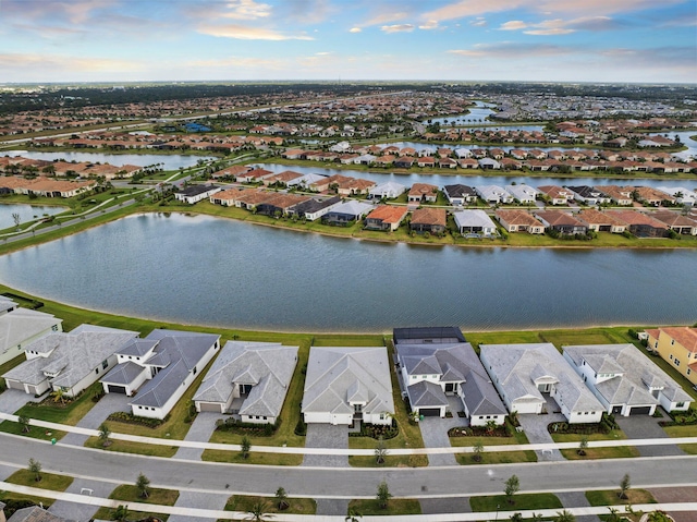 aerial view of residential area featuring a nearby body of water