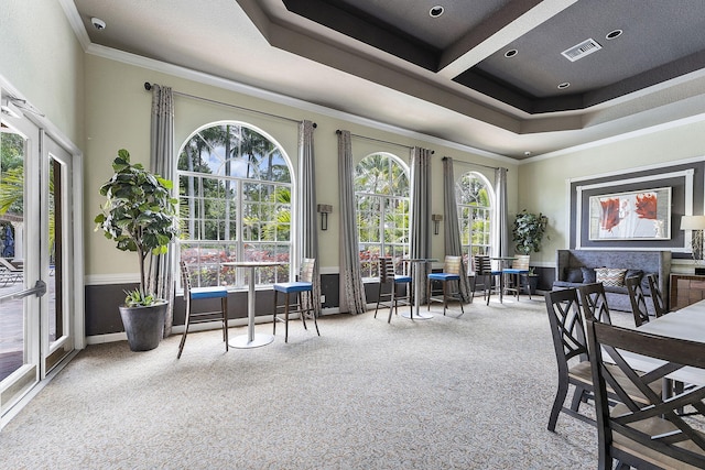 dining area featuring carpet floors and ornamental molding