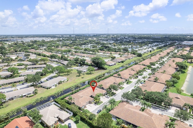 aerial view of property and surrounding area with nearby suburban area